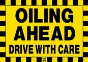 Oiling Ahead Drive With Care Sign Board - Signage Solutions Campbellford by B M R  Mfg  Inc